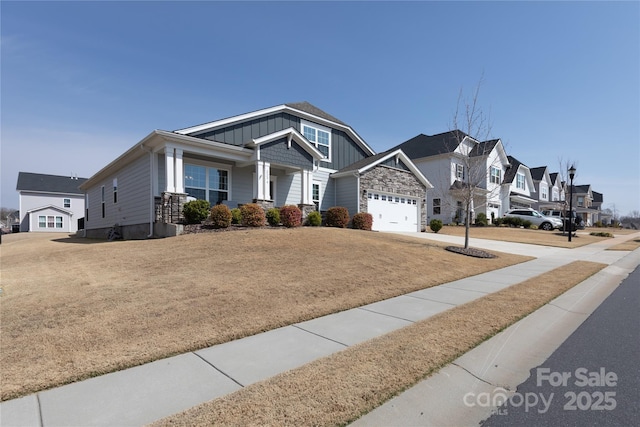 craftsman house with a garage, a residential view, board and batten siding, and concrete driveway