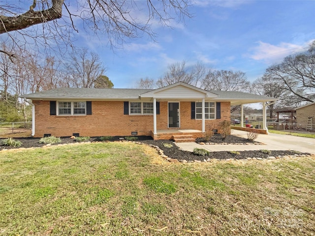 single story home featuring concrete driveway, a front yard, crawl space, an attached carport, and brick siding