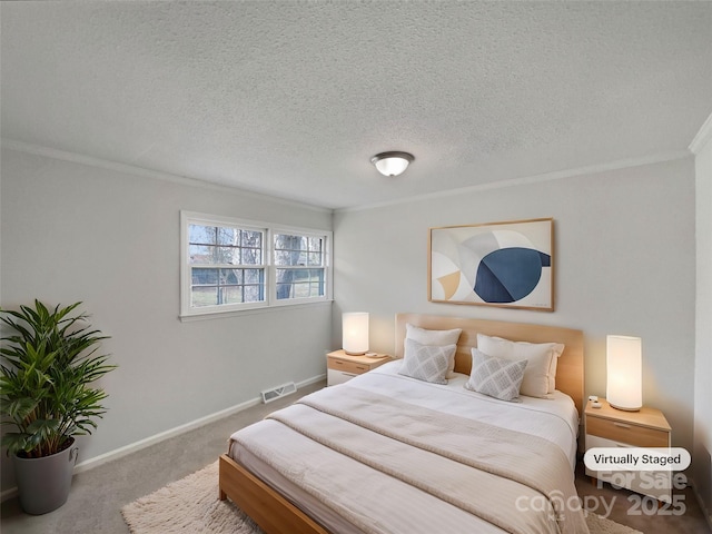 bedroom with baseboards, visible vents, carpet floors, ornamental molding, and a textured ceiling