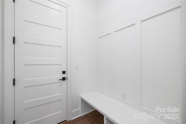 mudroom with dark wood finished floors