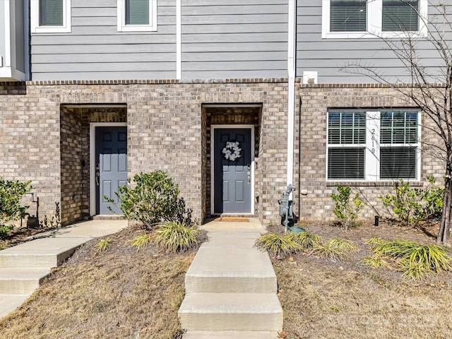 entrance to property with brick siding