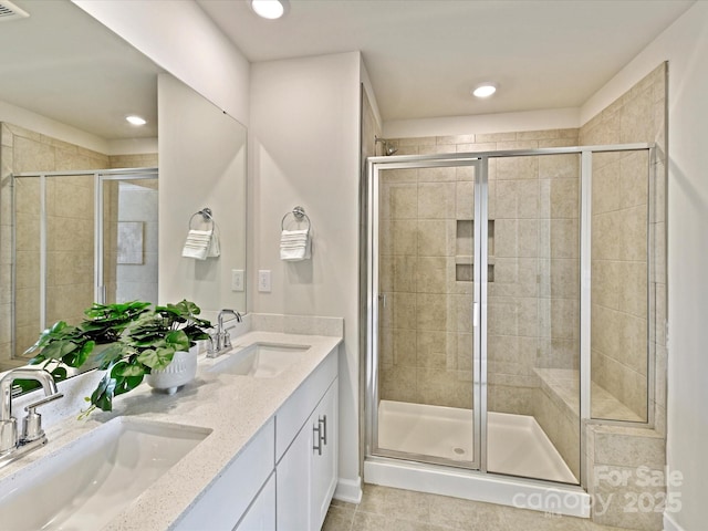 bathroom featuring a sink and a shower stall