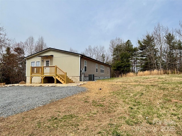 exterior space with crawl space and central AC unit