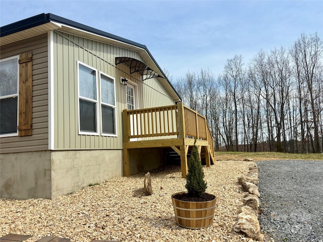 view of side of property with a deck