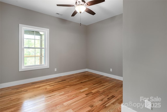 82 Arrowood Rd, Weaverville, NC 28787 - empty room featuring light wood finished floors, a ceiling fan, and baseboards