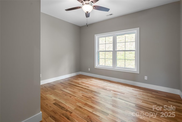 82 Arrowood Rd, Weaverville, NC 28787 - spare room with baseboards, light wood-style flooring, and ceiling fan