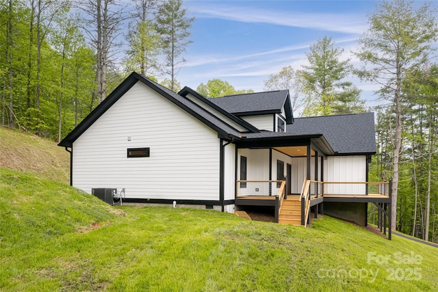 82 Arrowood Rd, Weaverville, NC 28787 - rear view of property with a yard, a wooden deck, roof with shingles, and central AC unit