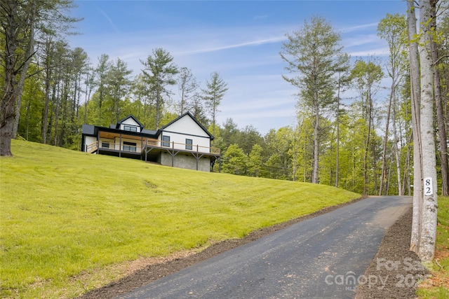 82 Arrowood Rd, Weaverville, NC 28787 - view of front of home with a front lawn and a deck