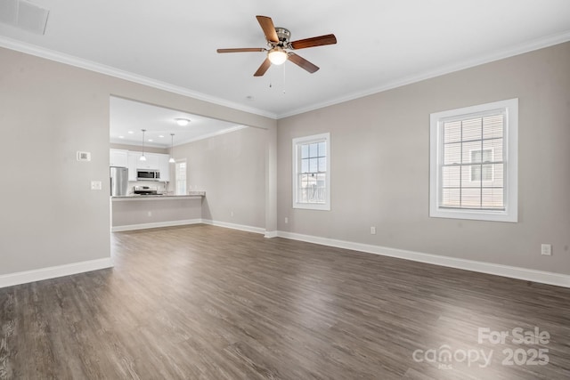 unfurnished living room featuring dark wood finished floors, plenty of natural light, and baseboards