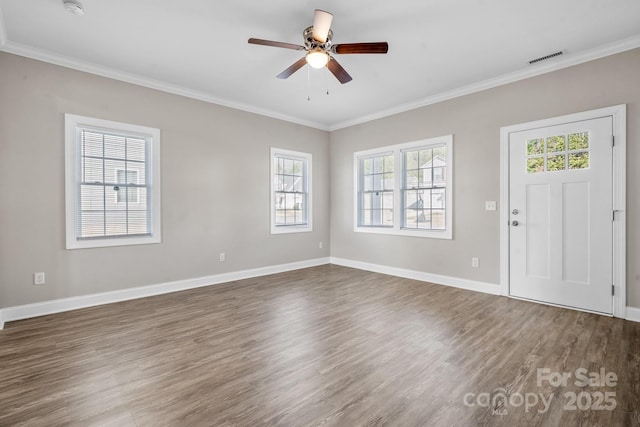 entryway featuring dark wood finished floors, a ceiling fan, visible vents, and ornamental molding