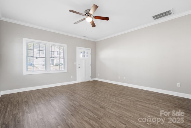 unfurnished living room featuring baseboards, a ceiling fan, visible vents, and ornamental molding