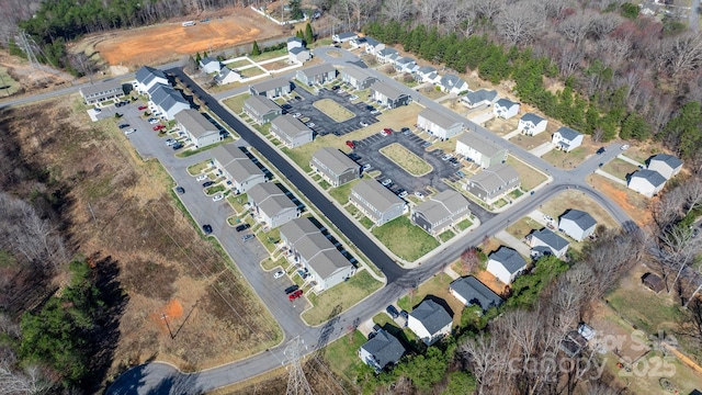 birds eye view of property with a residential view