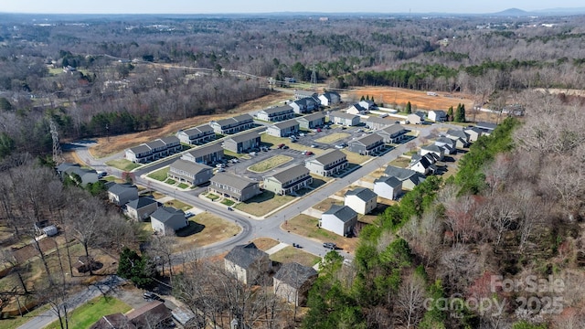 aerial view featuring a residential view and a view of trees