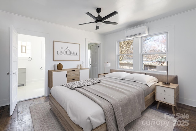 bedroom featuring an AC wall unit, hardwood / wood-style flooring, baseboards, and ceiling fan