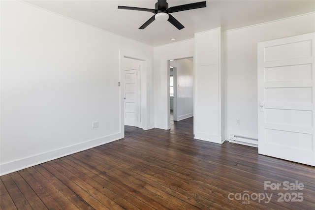 spare room with ceiling fan, a baseboard radiator, baseboards, and dark wood finished floors