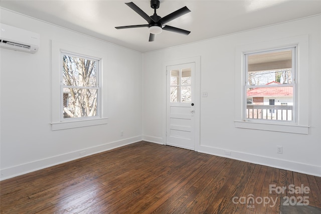 entryway with ceiling fan, baseboards, dark wood-style floors, and a wall unit AC