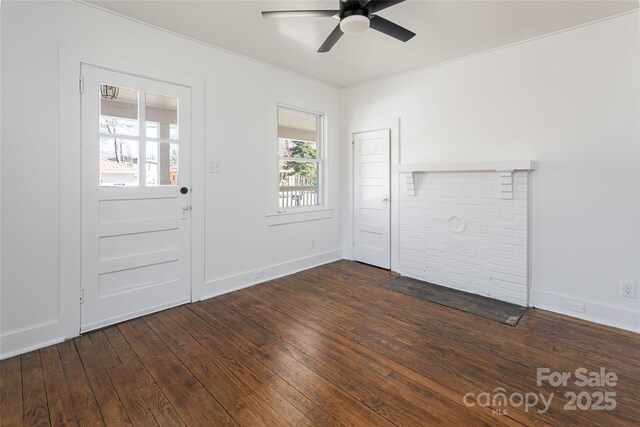 interior space featuring baseboards, ceiling fan, and dark wood-style flooring