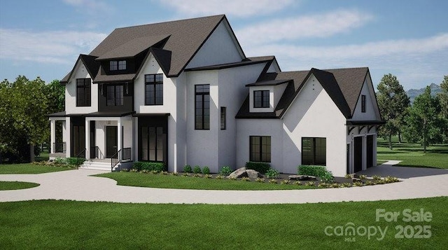 view of front of home featuring stucco siding and a front yard