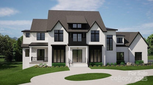 view of front of home with a front lawn and stucco siding