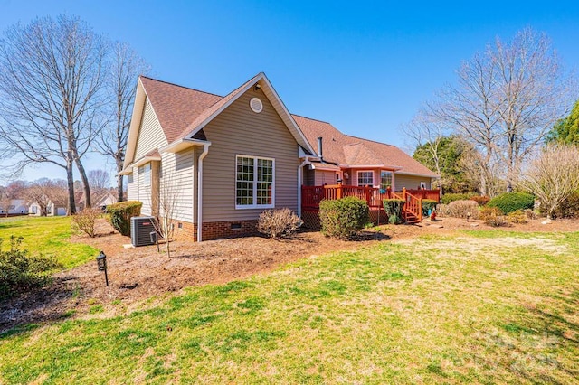 exterior space featuring crawl space, central AC unit, a front yard, and a deck