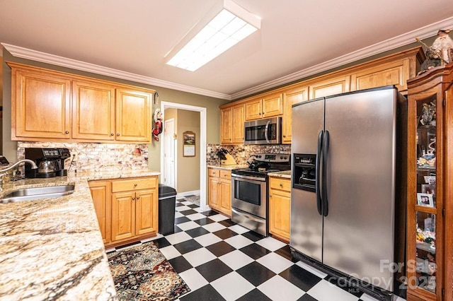 kitchen featuring tasteful backsplash, crown molding, dark floors, stainless steel appliances, and a sink