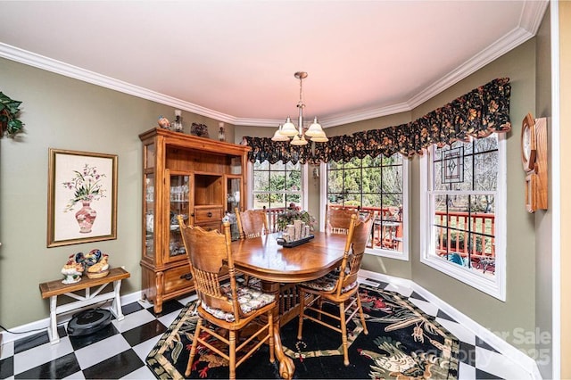 dining space with tile patterned floors, baseboards, and ornamental molding