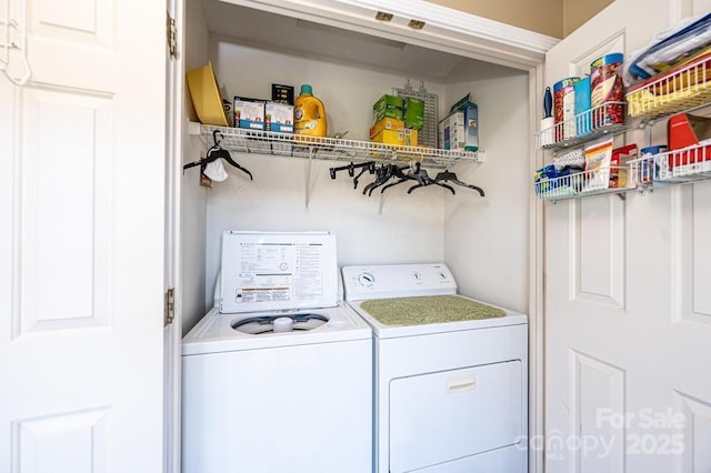 laundry area with laundry area and separate washer and dryer