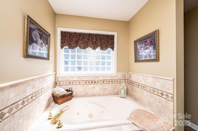 full bathroom with a tub with jets