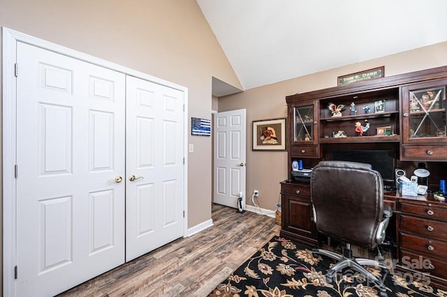 office with vaulted ceiling, wood finished floors, and baseboards