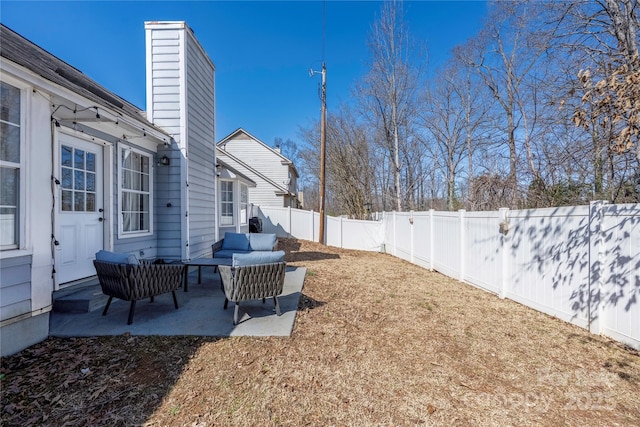 view of yard with outdoor lounge area, a patio, and a fenced backyard