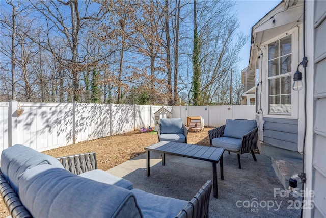 view of patio / terrace with an outdoor living space and a fenced backyard