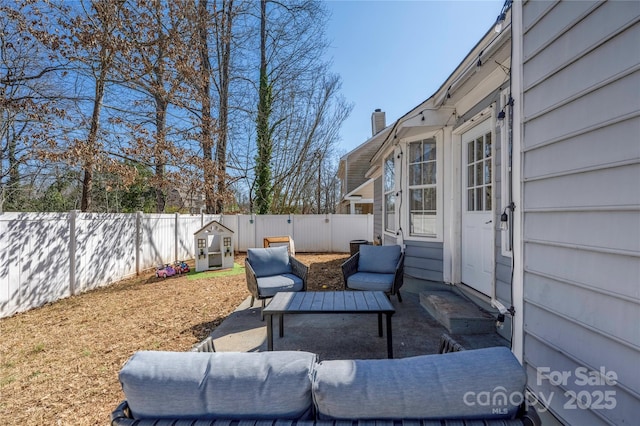 view of patio / terrace with a fenced backyard and an outdoor hangout area