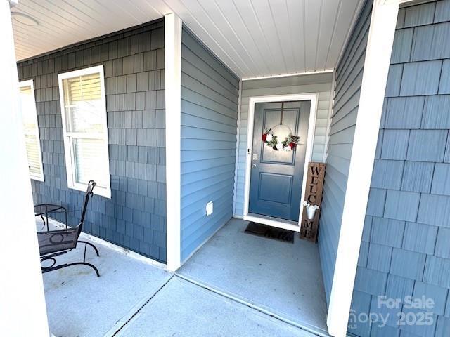 entrance to property with covered porch