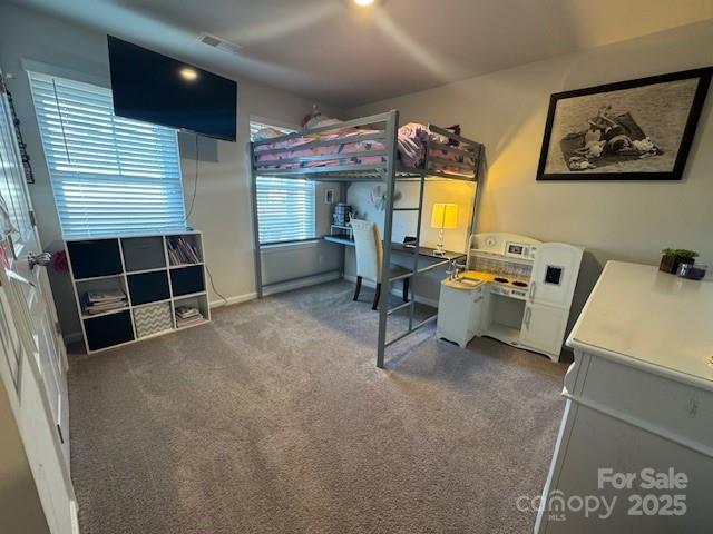 carpeted bedroom with visible vents