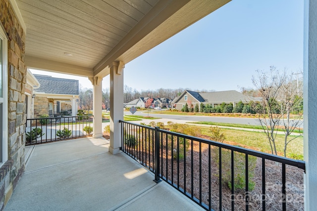 balcony with a residential view and a porch