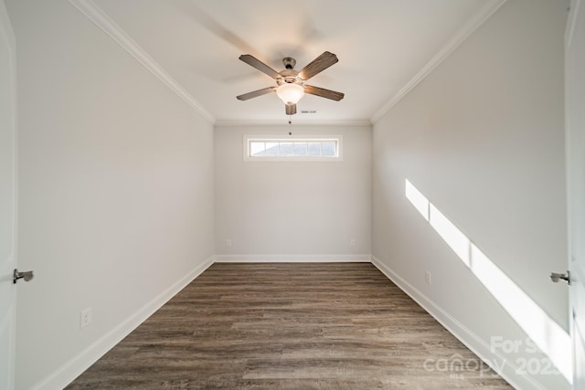 unfurnished room featuring visible vents, ceiling fan, baseboards, ornamental molding, and wood finished floors