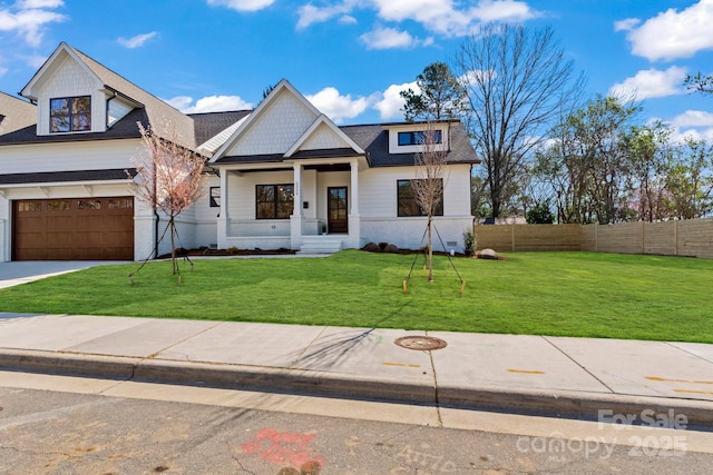 view of front facade featuring an attached garage, roof with shingles, and concrete driveway