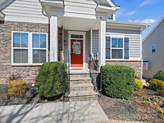 view of exterior entry featuring stone siding