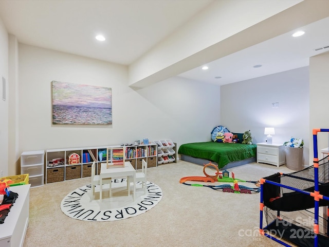 carpeted bedroom with visible vents and recessed lighting