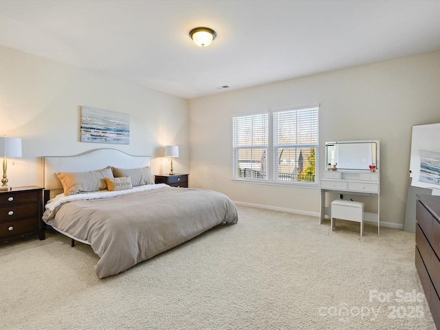 carpeted bedroom with baseboards