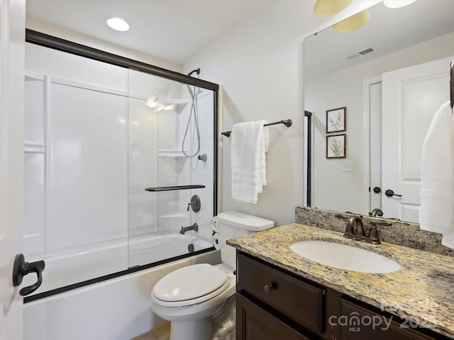 full bathroom with visible vents, enclosed tub / shower combo, toilet, and vanity