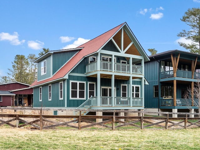 rear view of property featuring a yard