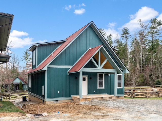 chalet / cabin with crawl space, a porch, and fence