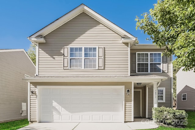 traditional-style home with an attached garage and driveway