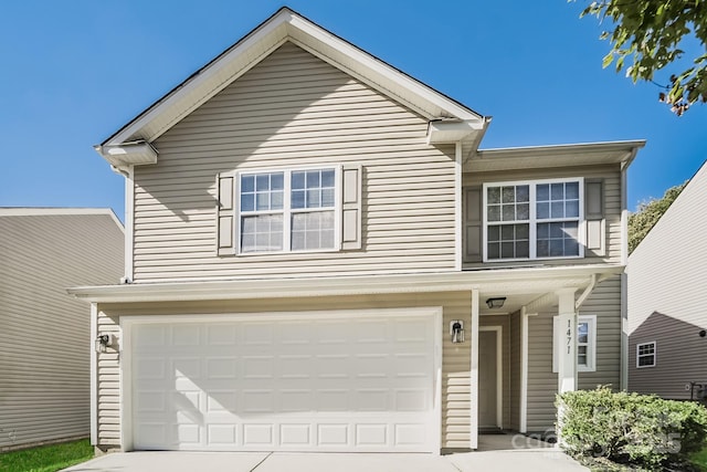 traditional home with an attached garage and driveway