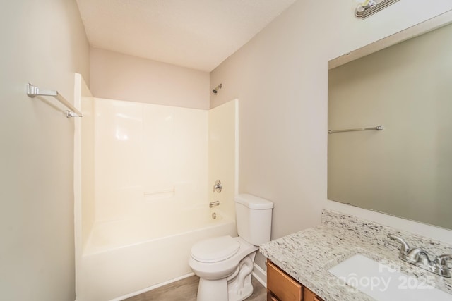 full bathroom featuring vanity, bathing tub / shower combination, toilet, and wood finished floors