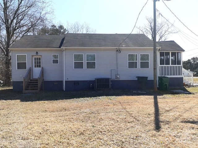 back of property with entry steps, central AC, a lawn, a sunroom, and crawl space