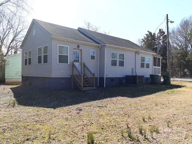 view of front of property featuring central AC unit and crawl space