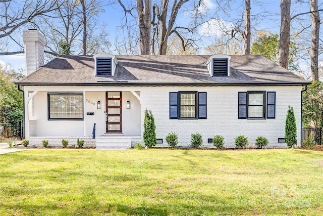view of front of house featuring crawl space, brick siding, a front yard, and a shingled roof