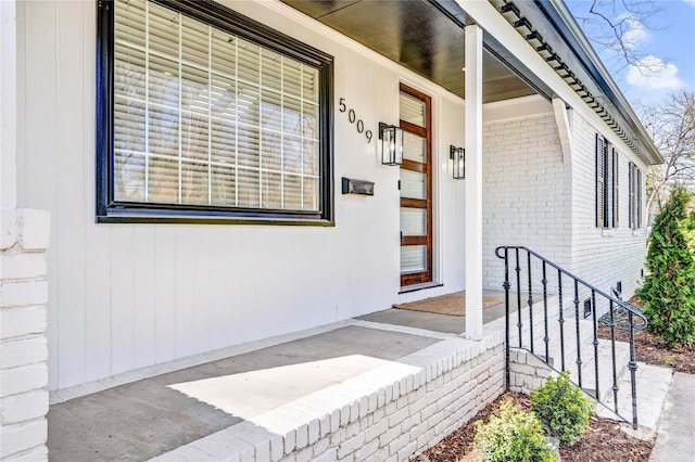 property entrance with brick siding